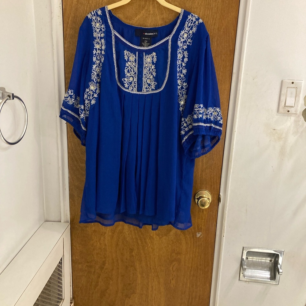Denim 24/7  sheer dark blue blouse with embroidery on chest and sleeves.